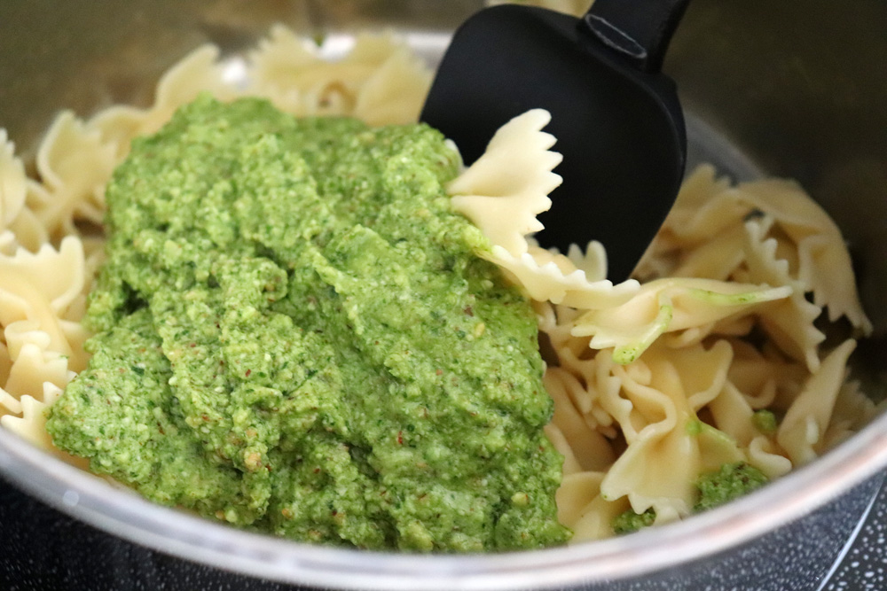 Add pesto to pasta