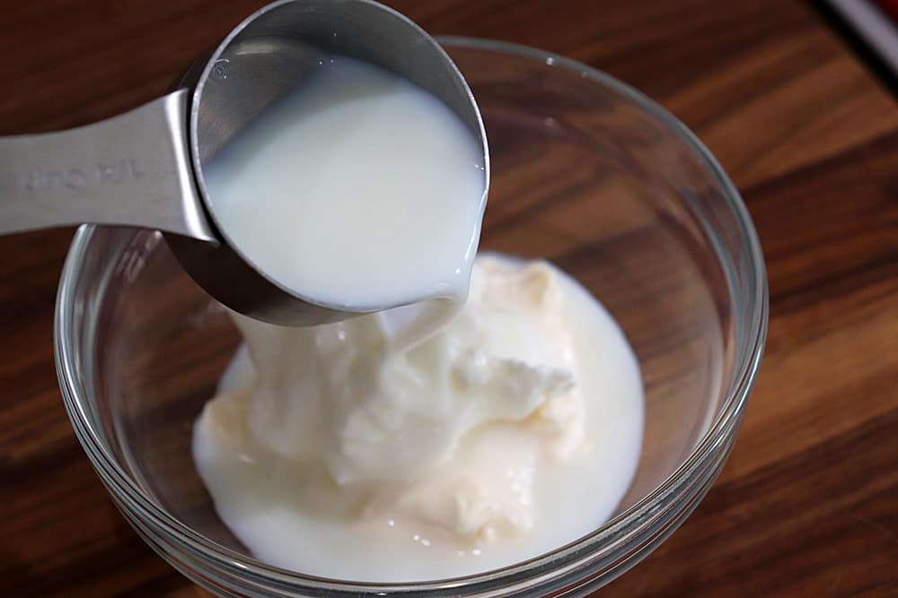 Adding almond Milk to the bowl