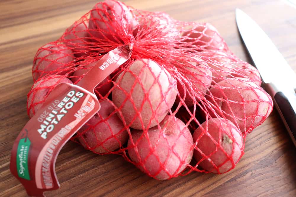 Bag of baby red potatoes for Warm Potato Salad with Dijon Vinaigrette