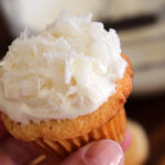 Bite shot of Vegan Coconut Cupcakes with Coconut Frosting