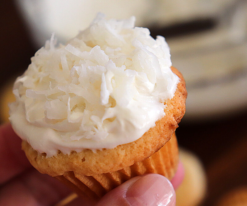 Bite shot of Vegan Coconut Cupcakes with Coconut Frosting