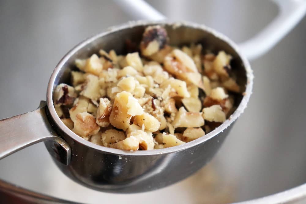 Adding chopped walnuts to Vegan Carrot Cake Oatmeal Cookies