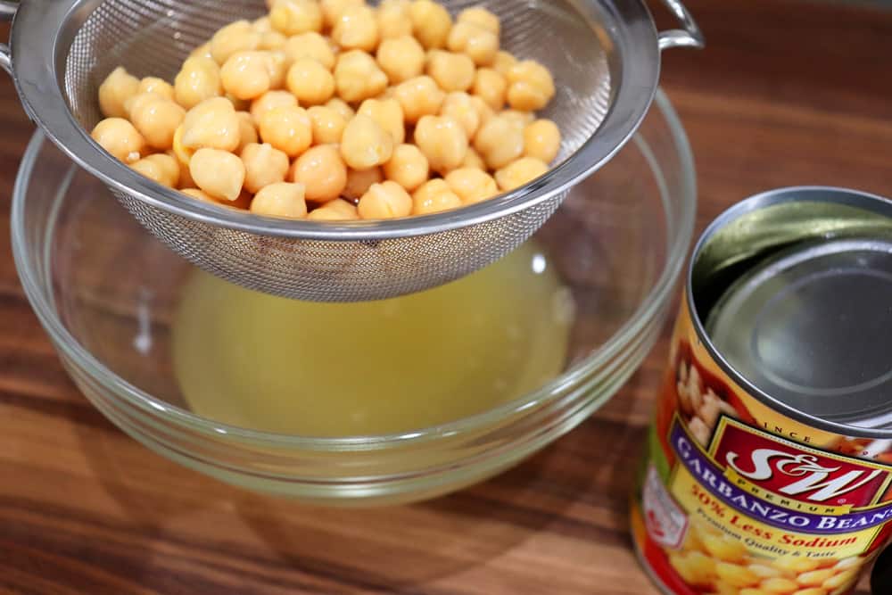 Draining a can of chickpeas