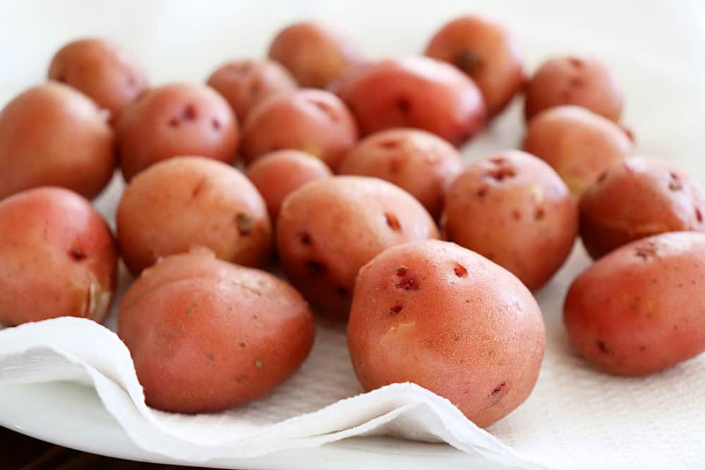 Drying the red potatoes on paper towels for the Warm Potato Salad with Dijon Vinaigrette