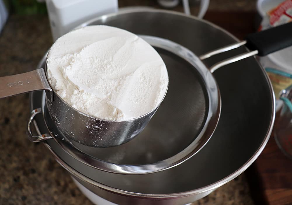 Adding flour to a strainer 