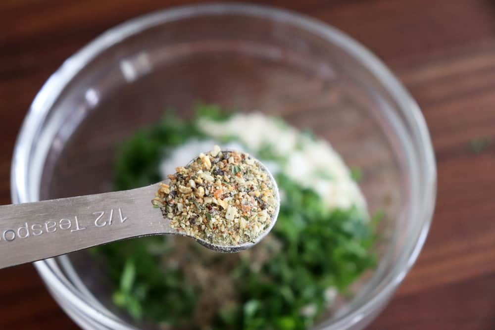 Adding italian seasoning to the breadcrumb mixture