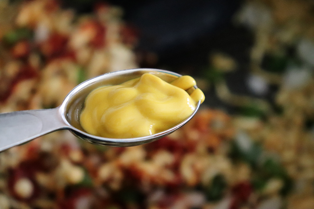 Adding mustard to the tofu