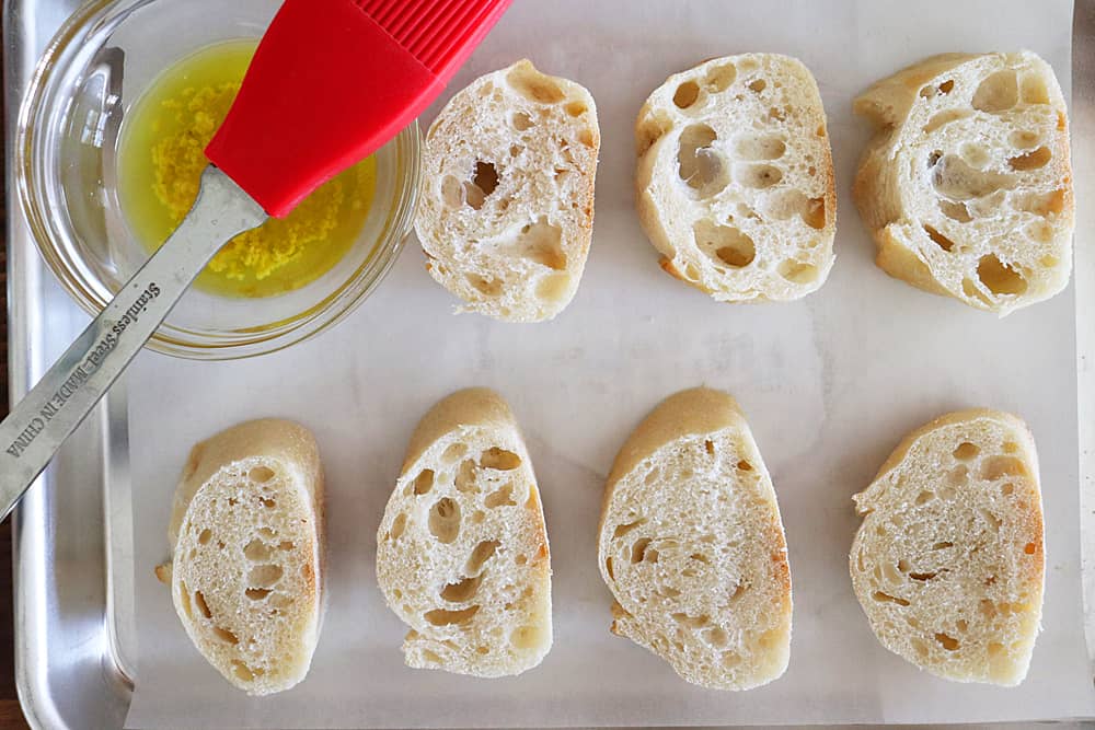 Sliced baquette on a sheet pan