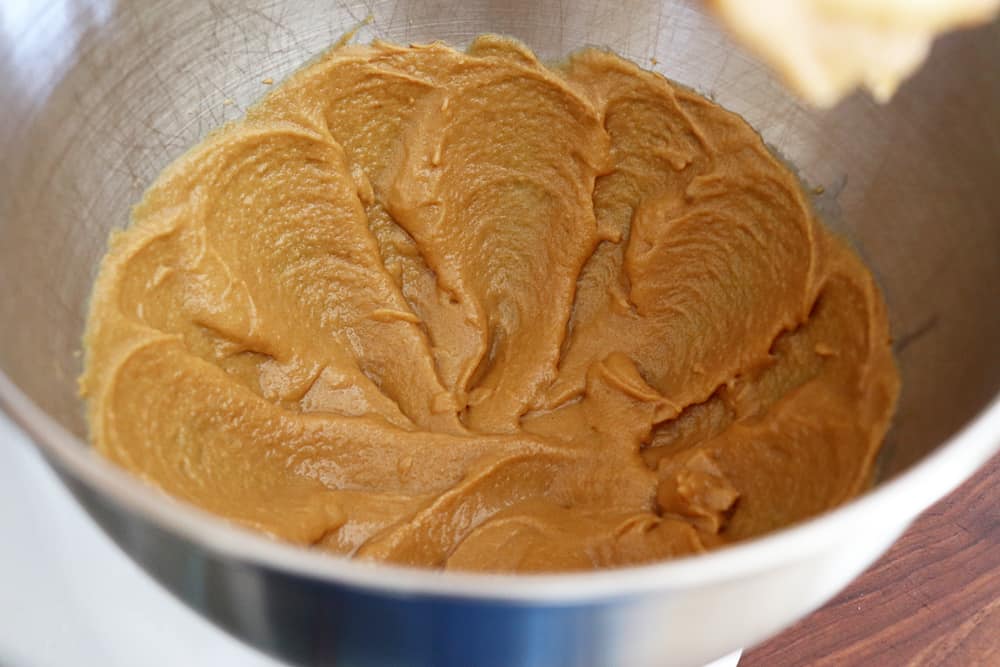 Creaming the peanut butter in a stainless steel mixing bowl