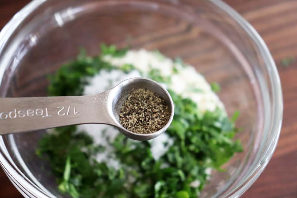 Adding pepper to the breadcrumb mixture