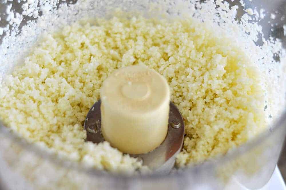 Riced Cauliflower in the bowl of a Food Processor