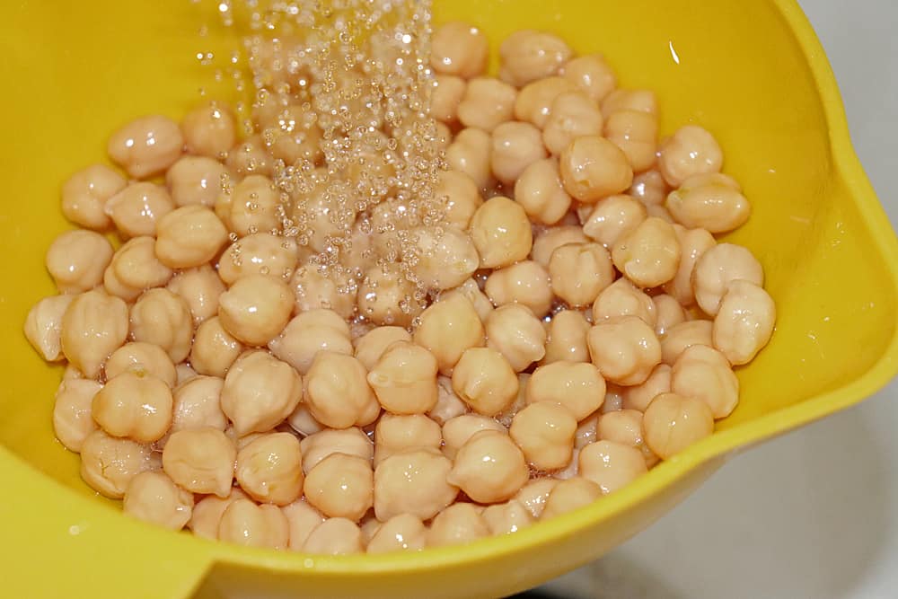 Draining and rinsing the chickpeas