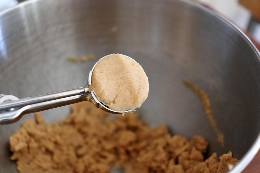 Cookie scoop full of peanut butter cookie dough