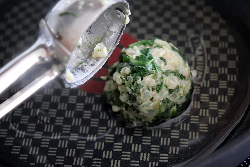Scooping mixture for the Vegan Spinach and Brown Rice Cakes