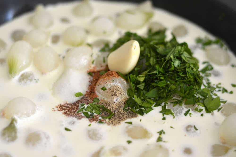 Adding seasonings to the pearl onions