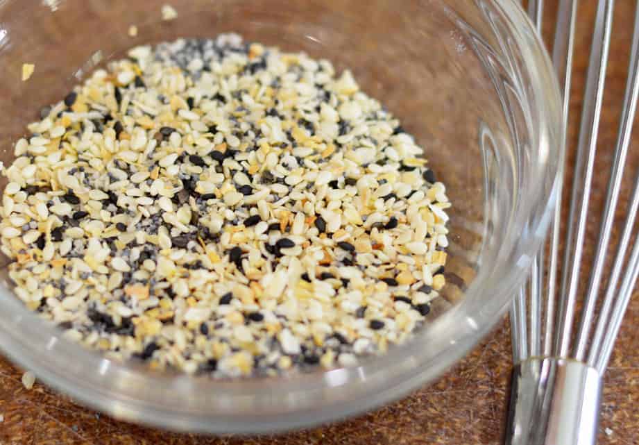 Everything but the bagel seasoning in a glass bowl with whisk