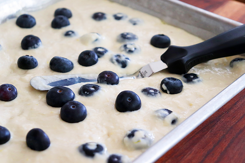 Spreading the batter in a lined quarter sheet pan