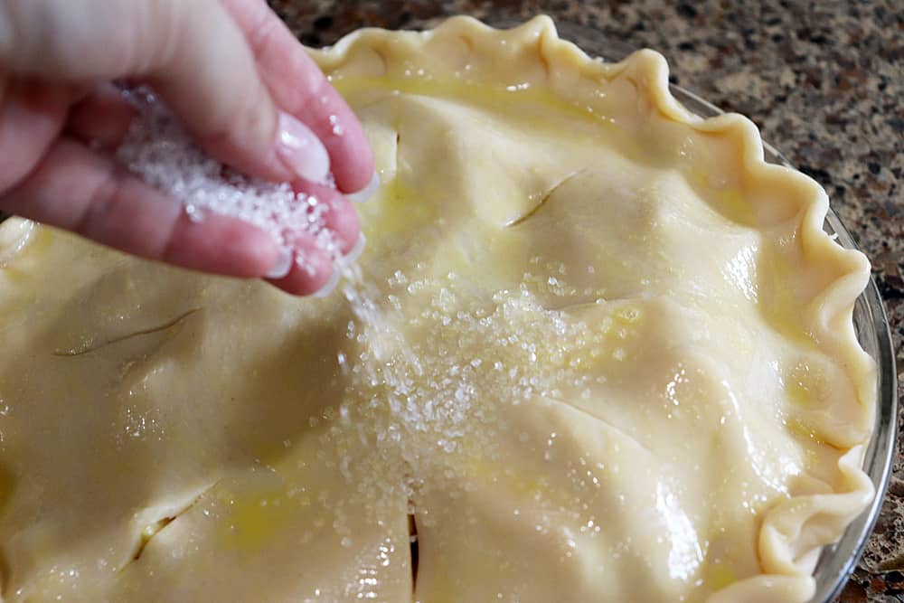 Sprinkling sugar onto pie crust