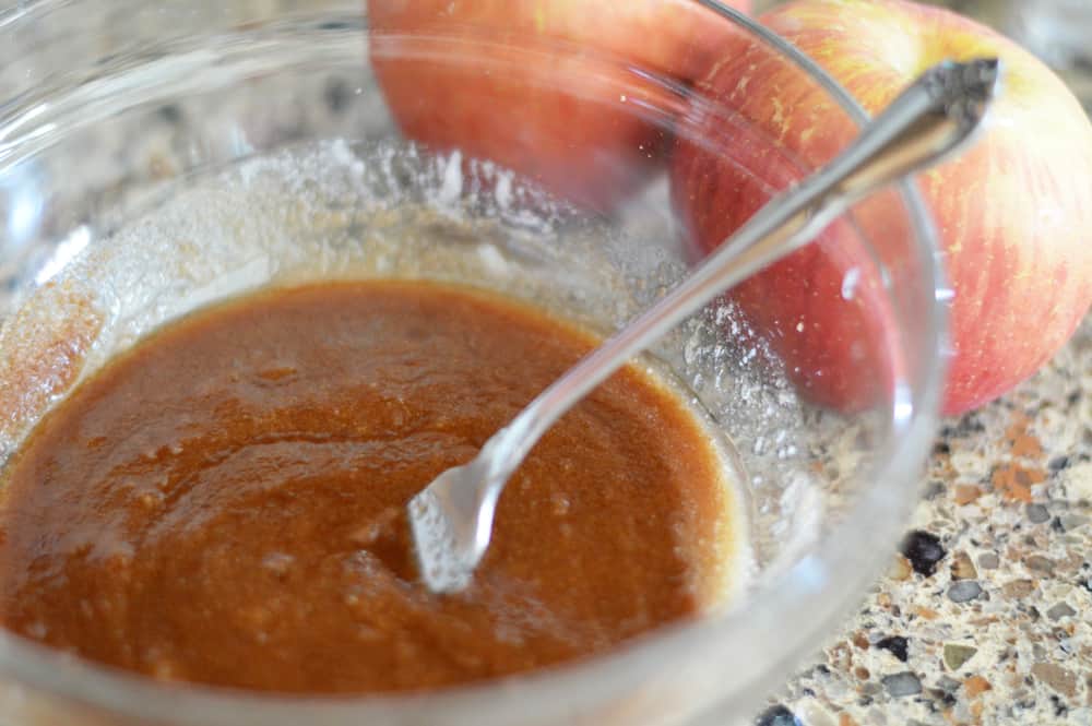 Adding melted butter to topping ingredients