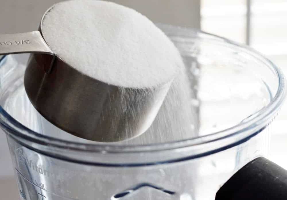 Pouring sugar into blender