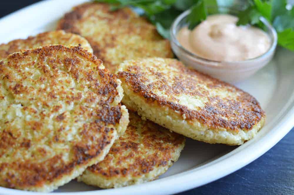 Plate of Cauliflower Fritters with Copycat Outback Bloomin' Onion Sauce