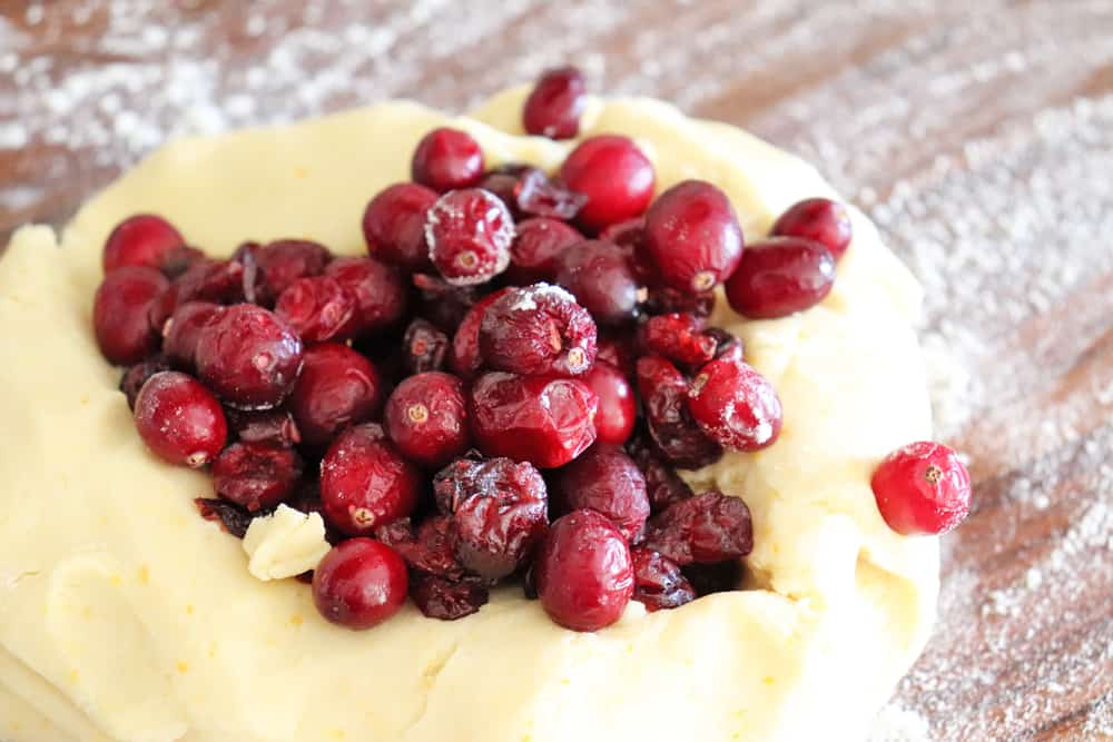 Adding both fresh and dried cranberries to dough