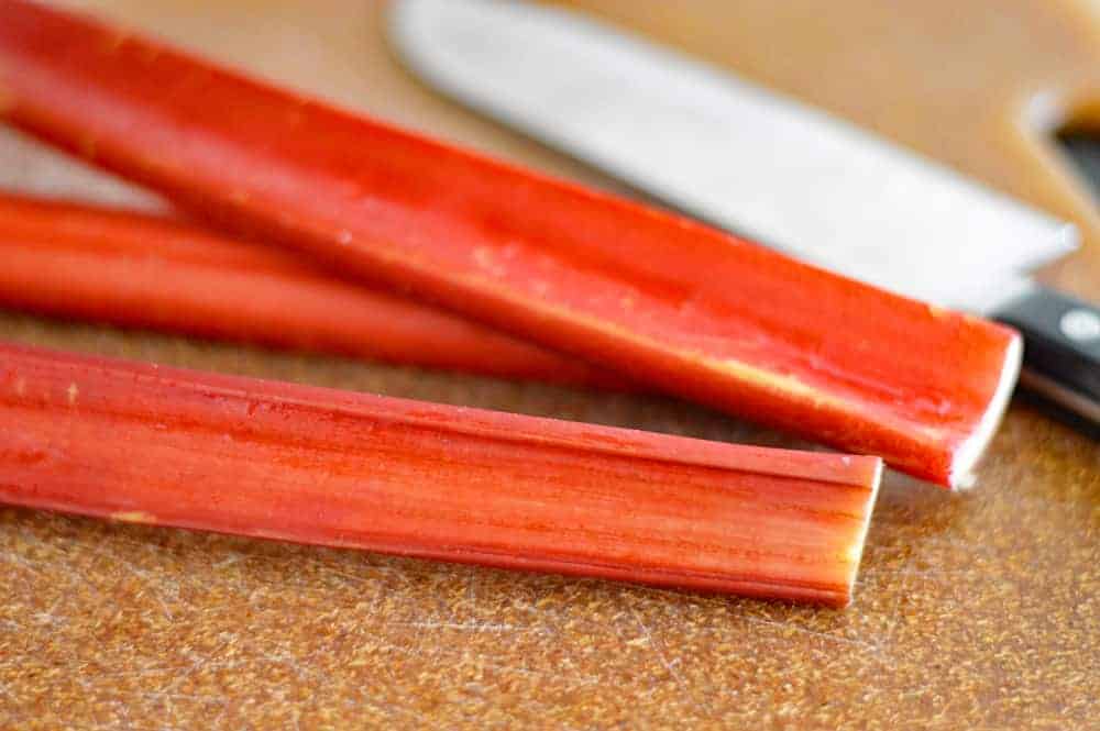 Fresh rhubarb stalks on a cutting board